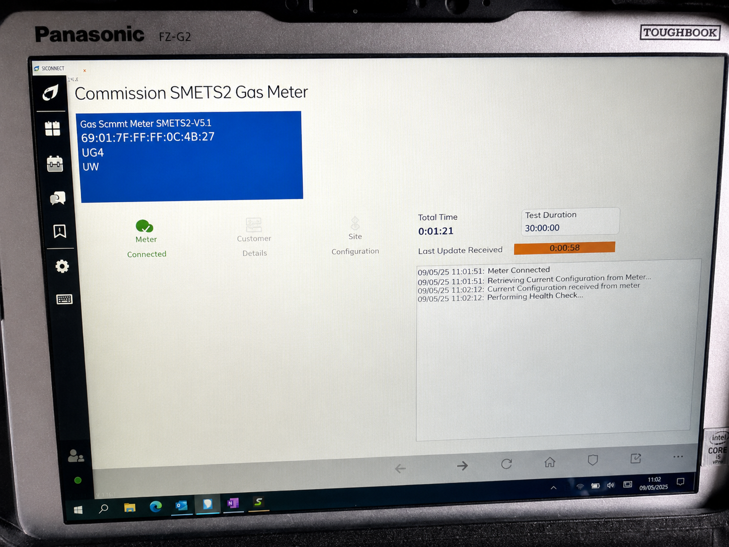Engineer's Panasonic Toughbook showing the SICONNECT gas meter commissioning tool